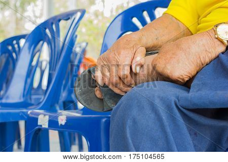 closeup hand of old asian man suffering from leprosy amputated hand