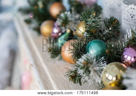 Christmas toys on a Christmas tree under snow