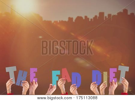 Hands holding word The Fad Diet against bright sunlight