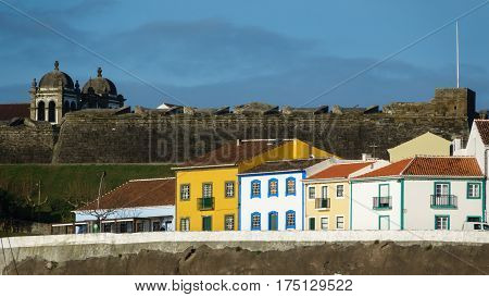 Long shot of colorful houses and fort in the city Angra do Heroismo, Terceira island, Azores islands. Good for postcards