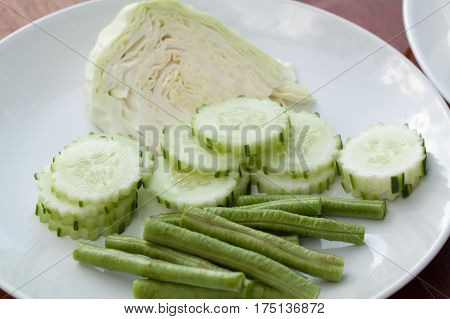 cabbage, cucumber and yardlong Vegetable side dish on white plate