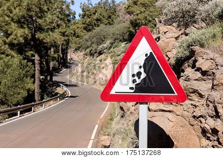 Road sign falling stones, Traffic sign caution possible falling rocks from the mountains