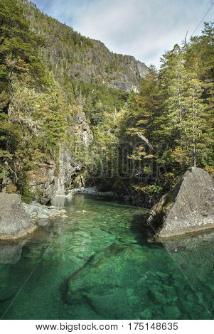 The Azul river is bright blue flowing through spectacular mountain landscape