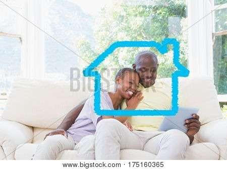 Digital composition of home outline with couple using digital tablet at home