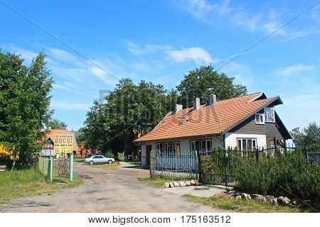 MORSKOE, KALININGRAD REGION, RUSSIA - JUNE 19, 2011: Guesthouses in the Morskoe (Pillkoppen) village in the Curonian Spit National Park. Russia.