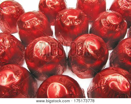 sweetmeats in red casing isolated on white background