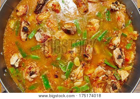 Paella from Spain recipe process ad water to get the broth boil