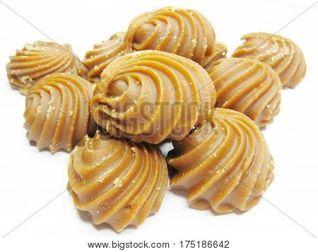 dairy brown sweetmeats in heap isolated on white background