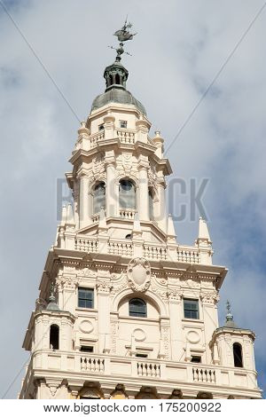 The tower of Miami historic skyscraper with a broke weather vane on a top (Florida).
