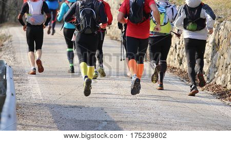 Many Runners Running Street Photographed From Behind