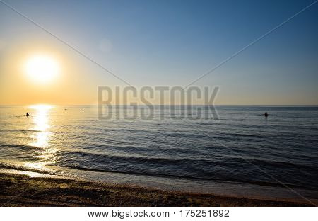 Sea Sunset. People Bathe In The Evening At Sunset In The Sea.