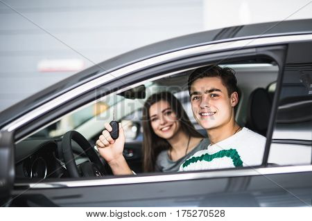 Young Couple With Keys To New Car