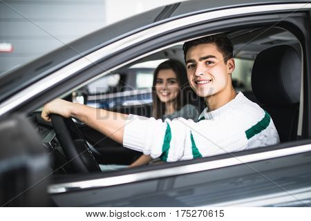 Young Couple With Keys To New Car