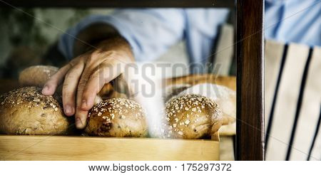 Man Hand Picking Baked Bread