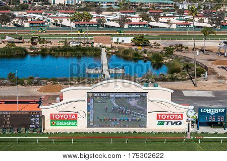 DEL MAR, CALIFORNIA - NOVEMBER 25, 2016:  Tote board and pond of the Del Mar racetrack, the second largest horse racing venue in the western United States.