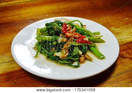 stir fried water spinach with chili and soy bean paste on dish