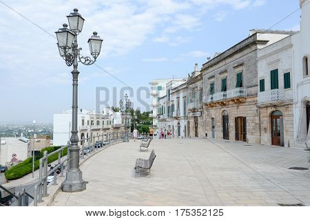 Cisternino Italy - 25 June 2016: people walking on the main square of Cisternino on Puglia Italy