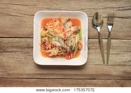 Top view Papaya salad of somtum in Thai food style for design diet background.