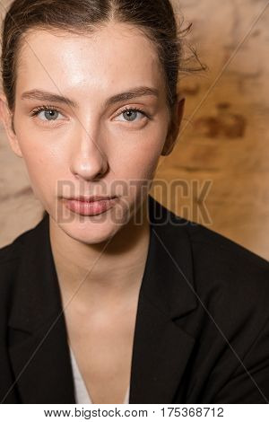 MILAN ITALY - FEBRUARY 25: Gorgeous model poses in the backstage just before Cividini show during Milan Women's Fashion Week on FEBRUARY 25 2017 in Milan.