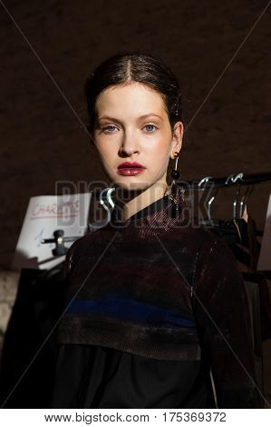 MILAN ITALY - FEBRUARY 25: Gorgeous model poses in the backstage just before Cividini show during Milan Women's Fashion Week on FEBRUARY 25 2017 in Milan.