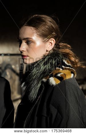 MILAN ITALY - FEBRUARY 25: Gorgeous model poses in the backstage just before Cividini show during Milan Women's Fashion Week on FEBRUARY 25 2017 in Milan.