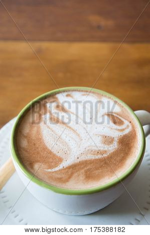 coffee cup and delicious cake strawberry and relax time moblie on table in coffee shop