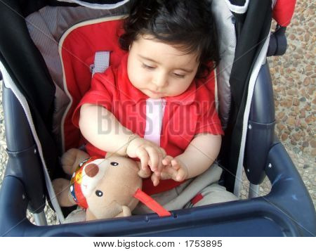 Child Sitting In A Buggy/Pushchair