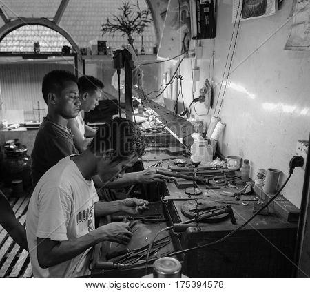 Burmese Men Working At A Jewellery Shop