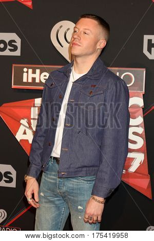 LOS ANGELES - MAR 5:  Macklemore, aka Ben Haggerty at the 2017 iHeart Music Awards at Forum on March 5, 2017 in Los Angeles, CA