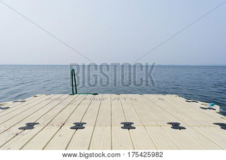 The plastic mooring on recreation facility the lake Uvildy. Summer Russia South Ural