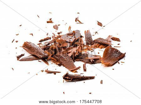Chocolate chips and curls on white background.