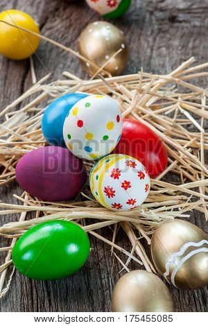 Colorful easter edds on a old wooden table