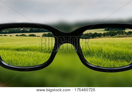 Clear vision through lenses of black framed eyeglasses