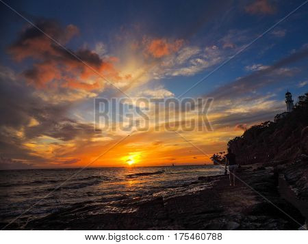 sunset at the diamondhead lighthouse from the beach
