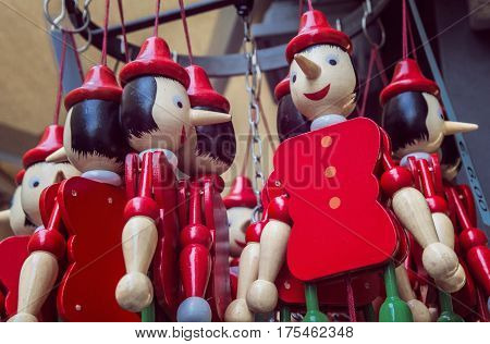 Pinocchio puppet in a red suit a traditional Italian souvenir