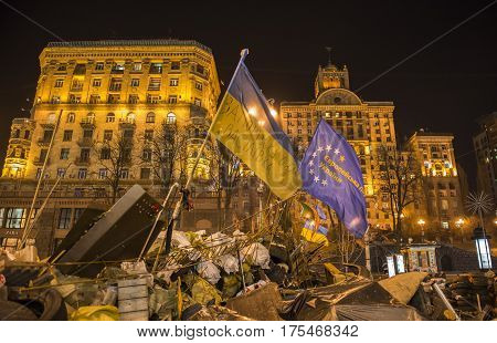 Kiev Ukraine - February 26 2014: Barricades with tires and flags in Kiev on Maidan Square during the revolution in the Ukraine.
