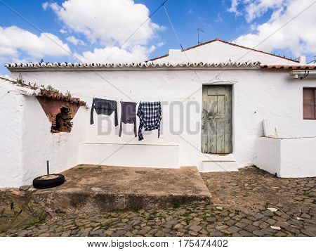MERTOLA PORTUGAL - MARCH 02 2017: Laundry drying in front of one of the houses in Mertola Alentejo region Portugal.
