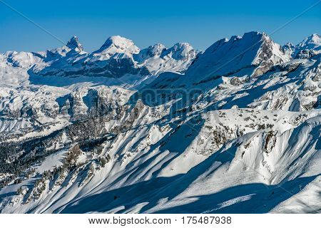 Beautiful Mountains In Snow. Evening Aerial View With Shadows.