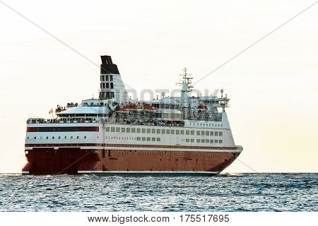 Red cruise liner's stern. Passenger ferry sailing from Riga to Stockholm