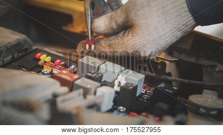Hood of the car - electric repair, electrical wiring , close up