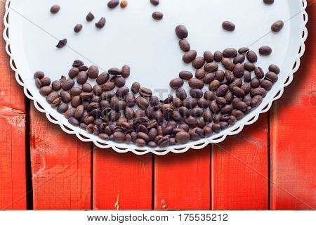 Coffee Beans On A White Plastic Plate. On Beautifull Wooden Background. Love. Insparation. On White