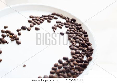 Coffee Beans On A White Plastic Plate. Beautifull Background. Love. Insparation. On White Plate.