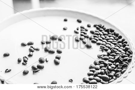 Coffee Beans On A White Plastic Plate. Beautifull Background. Love. Insparation. On White Plate.