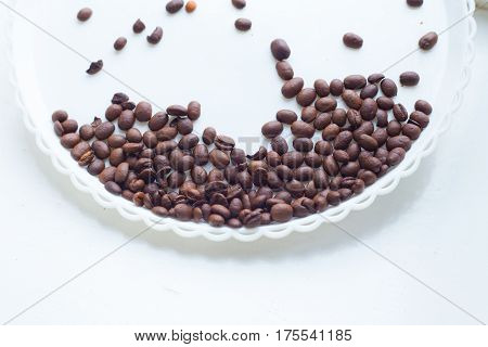 Coffee Beans On A White Plastic Plate. Beautifull Background. Love. Insparation. On White Plate.
