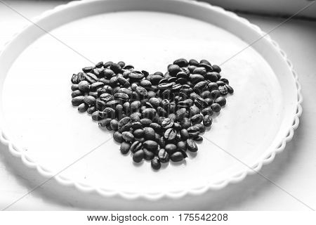 Coffee Beans In Form Of Heart On Beautifull Background. Love. Insparation. On White Plate.