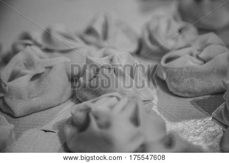Preparation Of Manti On A Kitchen Wooden Board. Traditional Asian Dumplings