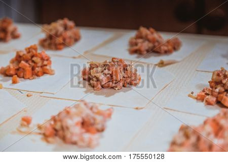 Preparation Of Manti On A Kitchen Wooden Board. Traditional Asian Dumplings
