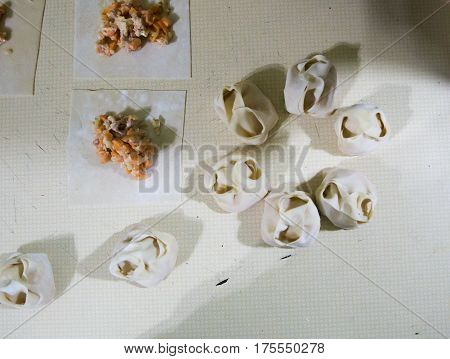 Preparation Of Manti On A Kitchen Wooden Board. Traditional Asian Dumplings