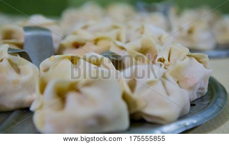 Preparation Of Manti On A Kitchen Wooden Board. Traditional Asian Dumplings