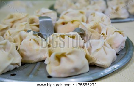 Preparation Of Manti On A Kitchen Wooden Board. Traditional Asian Dumplings